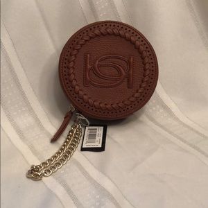 Bene faux leather wristlet.